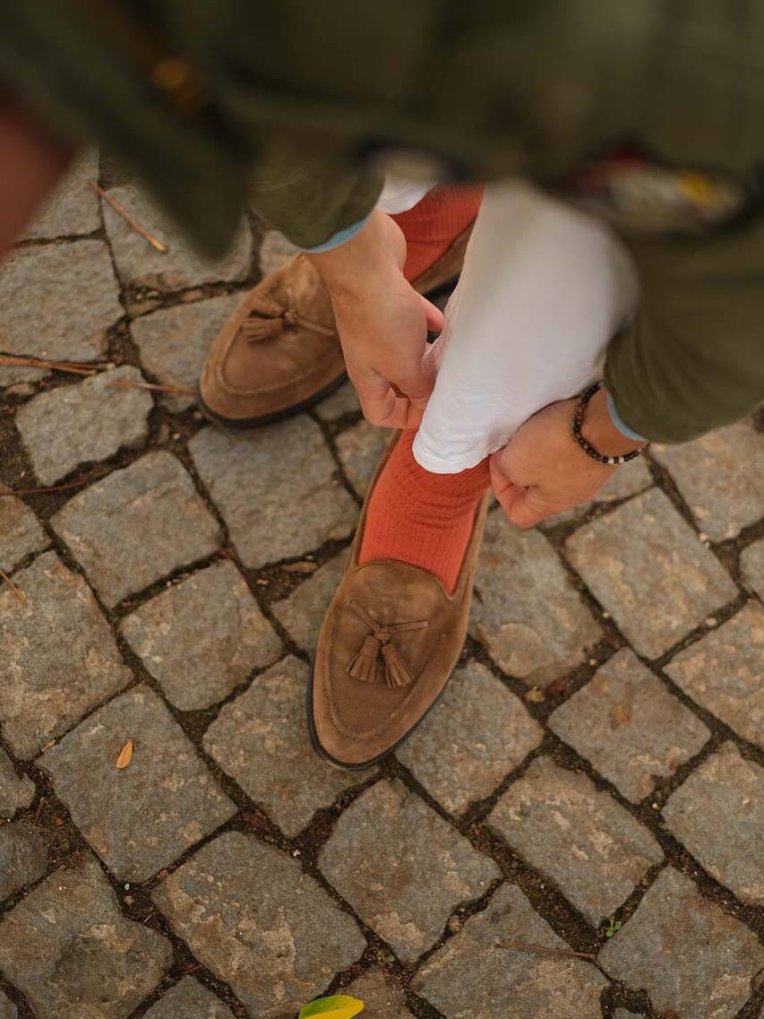 example of combining loafers with orange trousers and socks