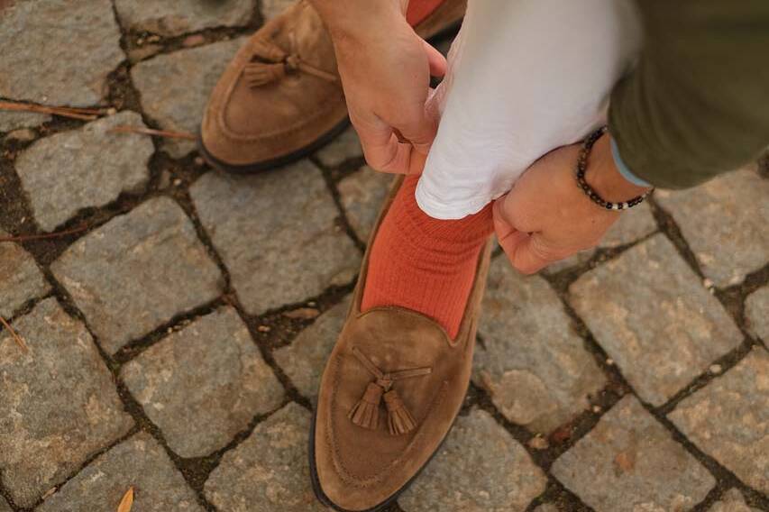 example of combining loafers with orange trousers and socks