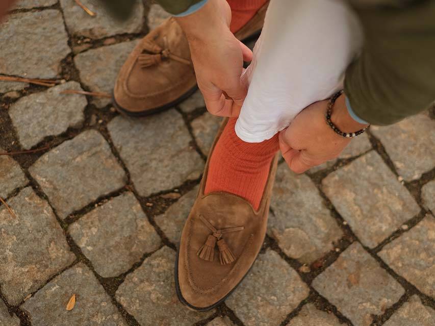 example of combining loafers with orange trousers and socks