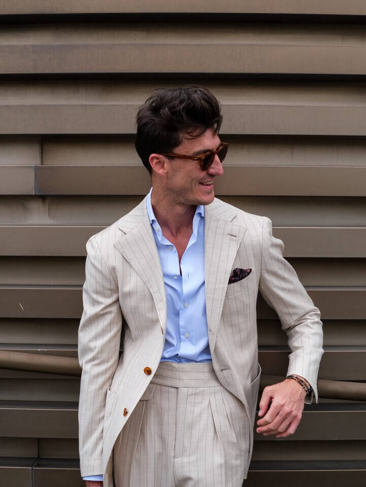 man in a white jacket with a pocket square