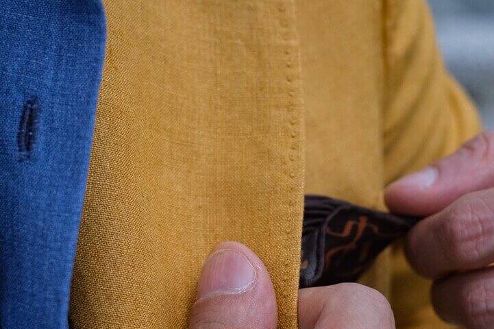 pocket square style on a yellow jacket