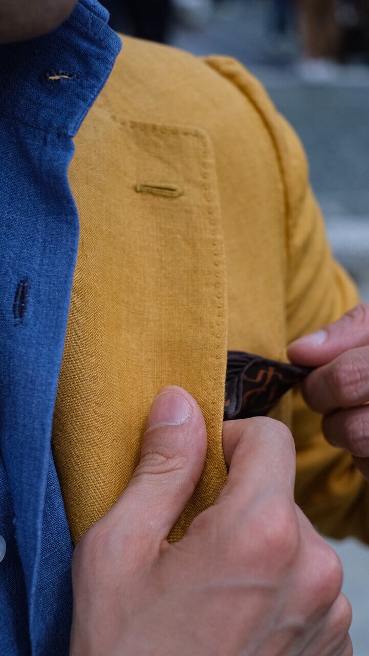 pocket square style on a yellow jacket