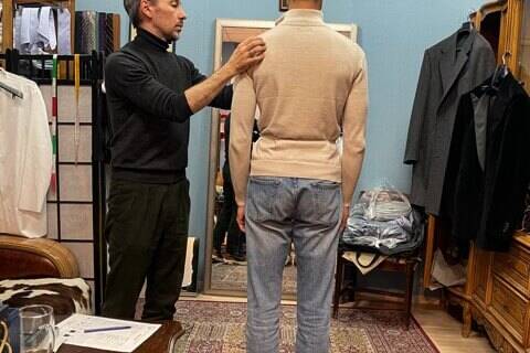 Dmitry Zabolotny takes measurements for bespoke jacket