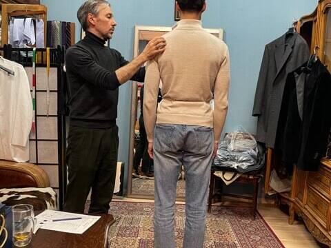 Dmitry Zabolotny takes measurements for bespoke jacket