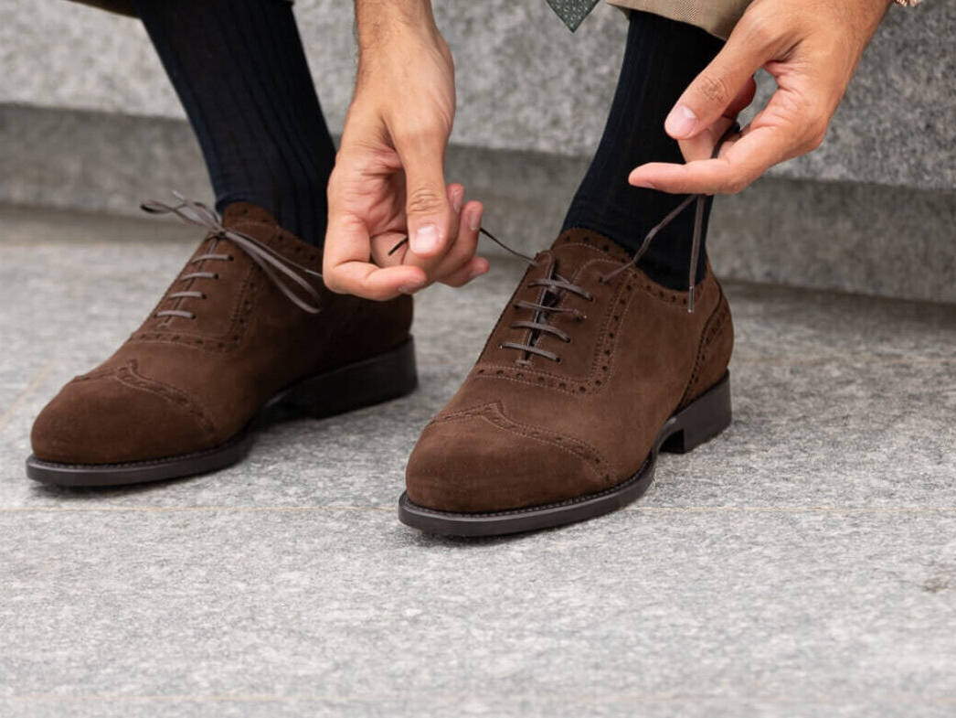 Brown men's brogues with elegant suit gentleman's style