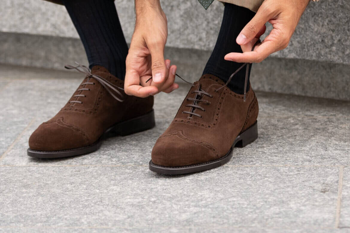 Brown men's brogues with elegant suit gentleman's style